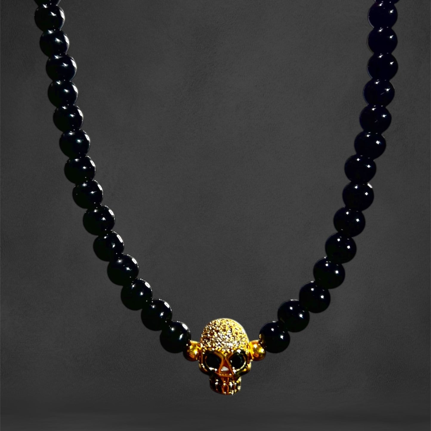 Perlas Black Calavera Gold